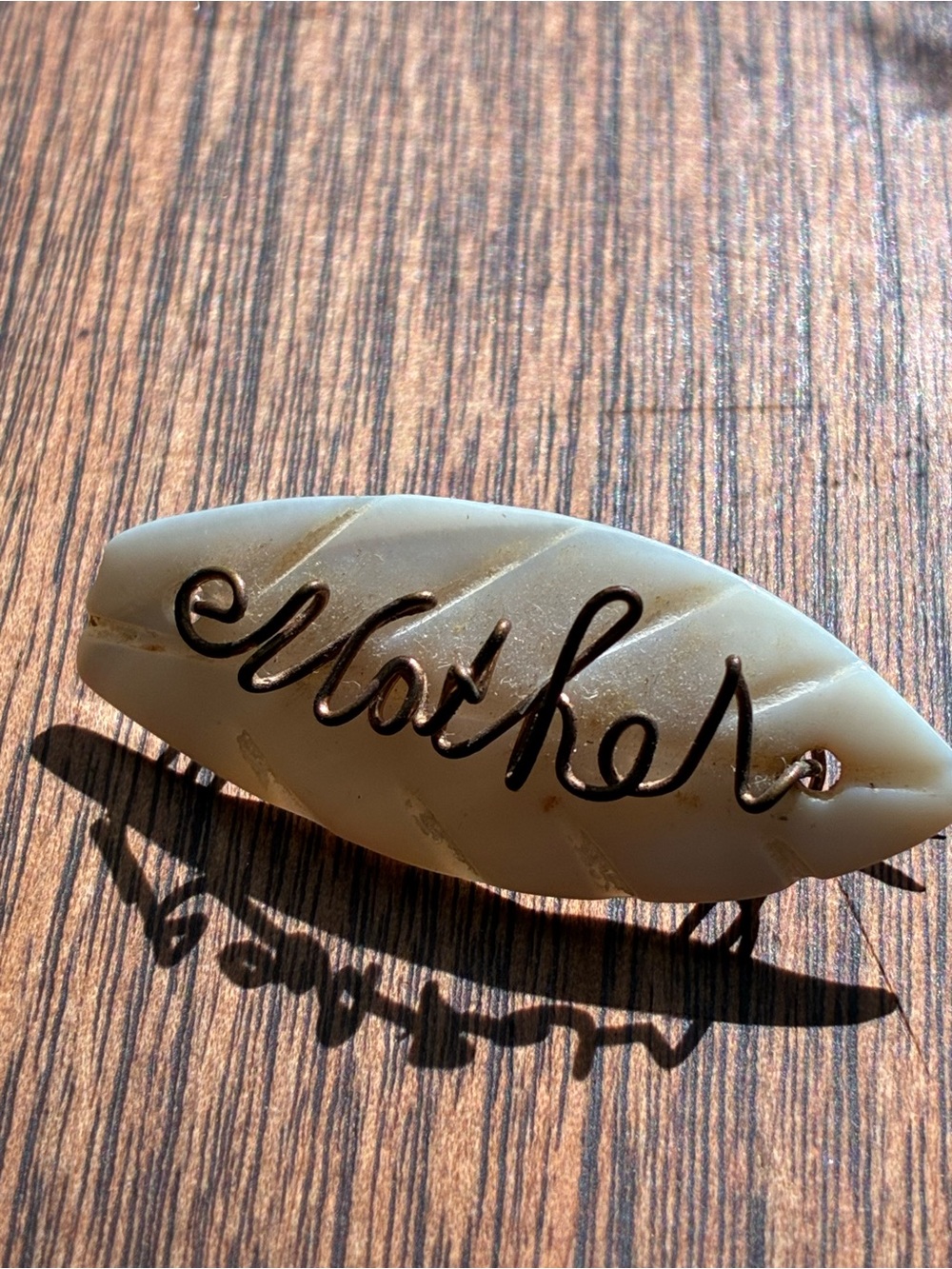 Vintage - “Mother” gold tone wire on Mother of Pearl Carved Brooch